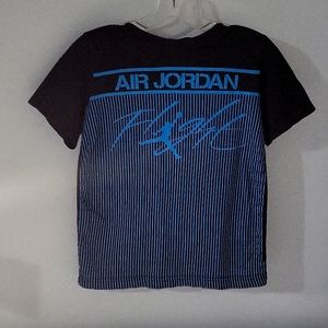 The brand is Air Jordan and the size is a medium 10-12 yrs